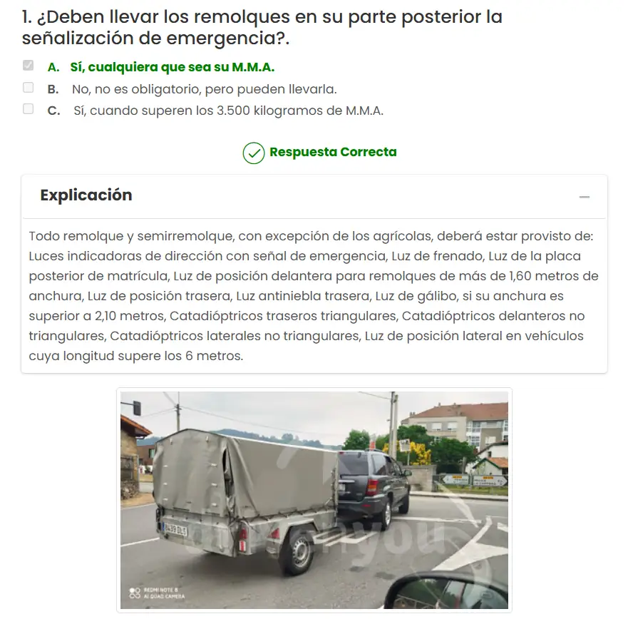 Captura de pantalla mostrando la explicación detallada de una pregunta del test de vehículos con remolque en DrivenYou